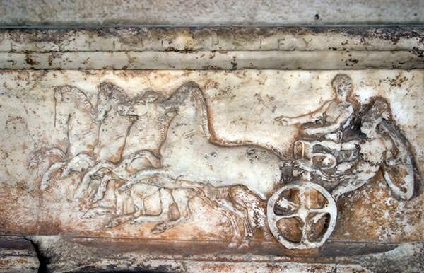 Ancient greek chariot race bas-relief
