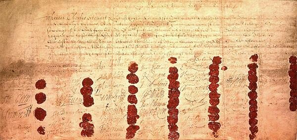 The death warrant of Charles I, showing the wax seals of the 59 signatories.